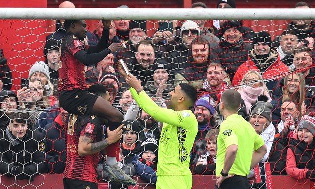 Beck-Ray Besongbap Enoru, Jordan Thomas Cullinane-Liburd and Jasbir Singh of Tamworth, attempt to fix the net prior to the Emirates FA Cup Third Round match between Tamworth and Tottenham Hotspur at The Lamb Ground on January 12, 2025 in Tamworth, England. (Photo by Michael Regan/Getty Images)