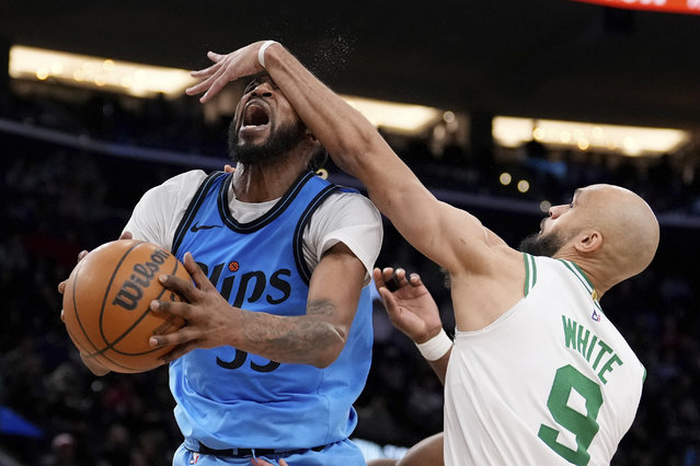 Los Angeles Clippers forward Derrick Jones Jr., left, is fouled while shooting by Boston Celtics guard Derrick White during the second half of an NBA basketball game, Wednesday, January 22, 2025, in Inglewood, Calif. (Photo by Mark J. Terrill/AP Photo)