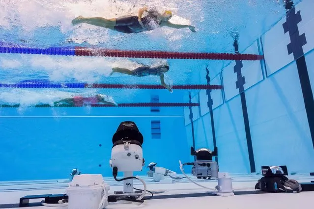 Underwater view shows remote and robotic cameras as athletes take part in the Women's 50m Freestyle heats during the swimming event at the Rio 2016 Olympic Games at the Olympic Aquatics Stadium in Rio de Janeiro on August 12, 2016. (Photo by Francois-Xavier MaritAFP Photo)