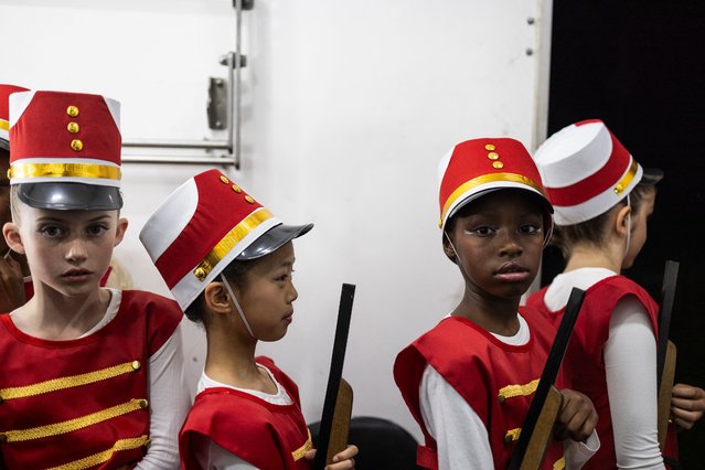 Dancers of the Youth Russian Ballet Company prepare backstage before performing in a production of the “Nutcracker”, a classic ballet traditionally performed during the Christmas period, at the annual Festival of Lights at Joburg Zoo, in Johannesburg, on December 8, 2023. (Photo by Roberta Ciuccio/AFP Photo)