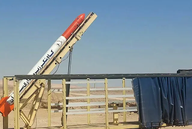 This picture released by the official website of the Iranian Defense Ministry on Tuesday, October 4, 2022, shows a Saman test tug rocket before being launched, in Iran. Iranian state media said Tuesday the government launched the space tug capable of shifting satellites between orbits on Monday. Hassan Salarieh, the country's space agency chief, said the Monday launch is expected to be followed by testing soon. Farsi words on the rocket read, “Saman sub-orbital explorer”. (Photo by Iranian Defense Ministry via AP Photo)