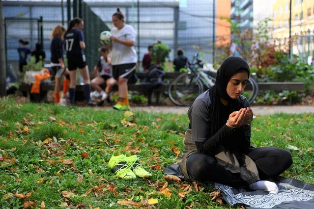 Fatima Ali, 26, prays between matches during the Ladies Super Liga 5-A-side tournament at The Colombo Centre in London, Britain on October 9, 2022. Founded in 2018, Sisterhood FC offers a chance for Muslim women to enjoy a break from traditional roles that many say are expected of them. “Even your brothers might be like what's the point of you going all the way from west London to southeast but I'll be like: 'I enjoy playing, we've got a team, this is it, we've got a match, we've got to go to do this”, said Fatima. (Photo by Hannah McKay/Reuters)
