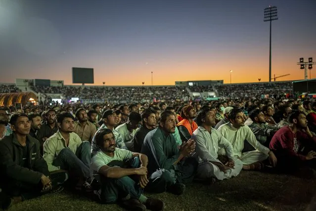 Soccer fans watch the FIFA World Cup Qatar 2022 match between Qatar and Senegal at the free-entry Industrial Area Fan Zone in the Asian Town Cricket Stadium, in Doha, Qatar, 25 November 2022. (Photo by Martin Divisek/EPA/EFE/Rex Features/Shutterstock)