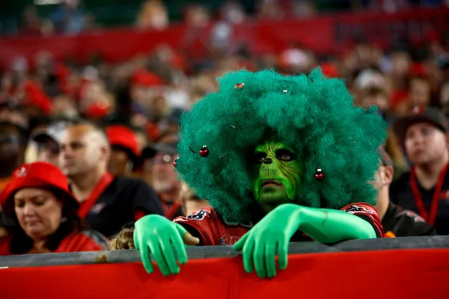 A Tampa Bay Buccaneers fan dressed as the Grinch watches from the stands during the third quarter of an NFL football game against the Atlanta Falcons on December 18, 2017 at Raymond James Stadium in Tampa, Florida. (Photo by Brian Blanco/Getty Images)