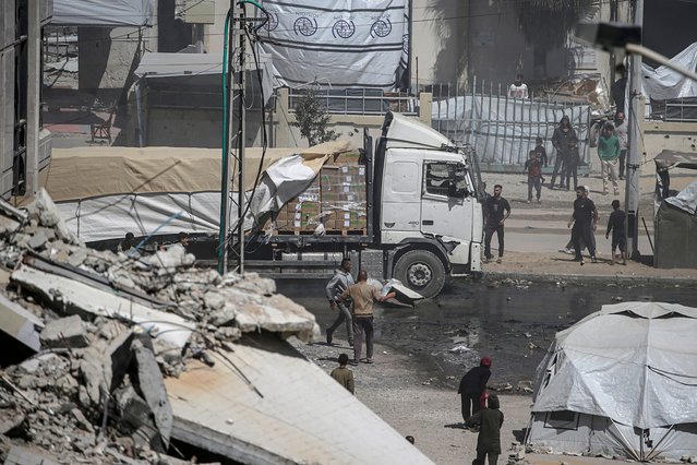 A humanitarian aid truck drives along Al Rashid road into Gaza City, 25 May 2025. The Government Media Office in Gaza reported on 24 May that at least 58 people died due to malnutrition, and 242 others due to a lack of food and medicine since 02 March 2025, when Israel closed border crossings, preventing the entry of essential supplies. (Photo by Mohammed Saber/EPA/EFE)