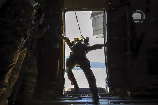 In this photo provided by the Greek Defense Ministry, paratroopers take part in a Greek-US military exercise near Athens, on Friday, September 11, 2020. Prime Minister Kyriakos Mitsotakis was to outline the details of a program Saturday to boost Greece's defense capabilities, amid heightened tensions with neighboring Turkey over rights to resources in the eastern Mediterranean. (Photo by Greek Defense Ministry via AP Photo)