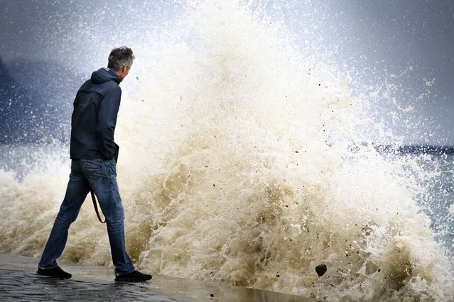 Big waves pound the lakeside promenade on the Lake of Geneva, in Vevey, Switzerland, January 3, 2018. Storm Burglind is causing strong gusts of wind of up to 200 kilometers per hour in some mountain areas. (Photo by Laurent Gillieron/Keystone via AP Photo)
