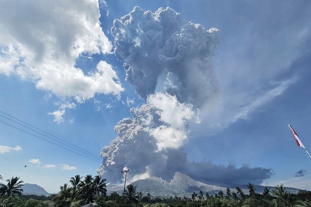 In photo released by Geological Agency (Badan Geologi) of the Indonesia's Ministry of Energy and Mineral Resources, Mount Lewotobi Laki-Laki spews volcanic materials during an eruption in East Flores, Indonesia, Monday, July 7, 2025. (Photo by Badan Geologi via AP Photo)