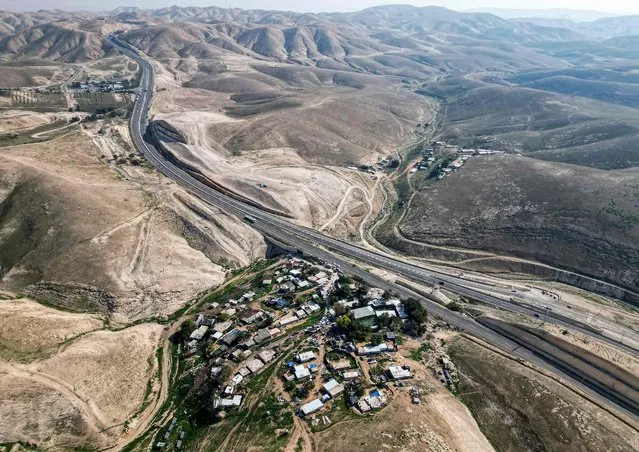 This picture taken on January 23, 2023 shows an aerial view of the bedouin village of Khan al-Ahmar in the occupied West Bank, near the east Jerusalem suburb of Abu Dis. (Photo by Hazem Bader/AFP Photo)
