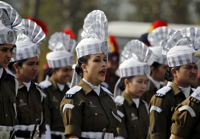An Indian policewoman yawns as she stands with others during a ceremony to mark Police Commemoration Day in Zewan, on the outskirts of Srinagar, October 21, 2015. Every year on October 21, Police Commemoration Day is observed to remember and pay respects to police personnel across India who were killed in the past year while performing different kinds of duties. (Photo by Danish Ismail/Reuters)