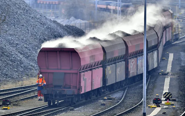 A train brings steaming coke to the Krupp Mannesmann steel factory in Duisburg, Germany, Friday, March 2, 2018. U.S. President Donald Trump risks sparking a trade war with his closest allies if he goes ahead with plans to impose steep tariffs on steel and aluminum imports, German officials and industry groups warned Friday. (Photo by Martin Meissner/AP Photo)