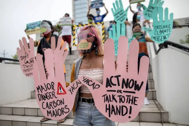 Filipino climate activists hold placards calling for climate action as a part of global climate change protests, in Quezon City, Metro Manila, Philippines, September 25, 2020. (Photo by Eloisa Lopez/Reuters)