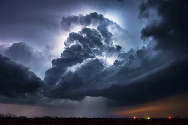 A severe thunderstorm lights up from intercloud lightning over Graham, Texas on April 2014. (Photo by Mike Mezeul II/Caters News)
