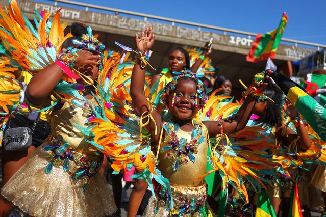 Children in Caribbean-themed costumes take part in the Children's Day Parade, during Notting Hill Carnival, in London, Britain on August 24, 2025. (Photo by Toby Melville/Reuters)