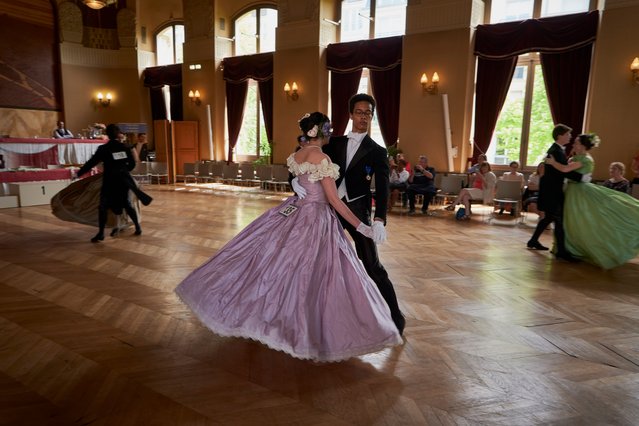 Dancers in historical 19th century attire are seen dancing a French version of the Polka on May 12, 2024 in Paris, France. Twenty four dancers gather in the sumptuous building of the Mayor office in the 15th arrondissement to participate in a unique historical dancing competition dressed in traditional clothing. (Photo by Remon Haazen/Getty Images)