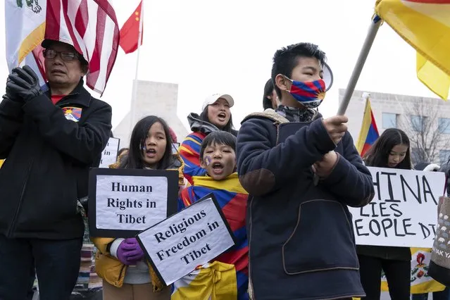 Children hold signs during a rally to commemorate the failed 1959 Tibetan uprising against China's rule, outside of the Chinese Embassy in Washington, Friday, March 10, 2023. The gathering took place on what is known as Tibetan National Uprising Day. (Photo by Jose Luis Magana/AP Photo)