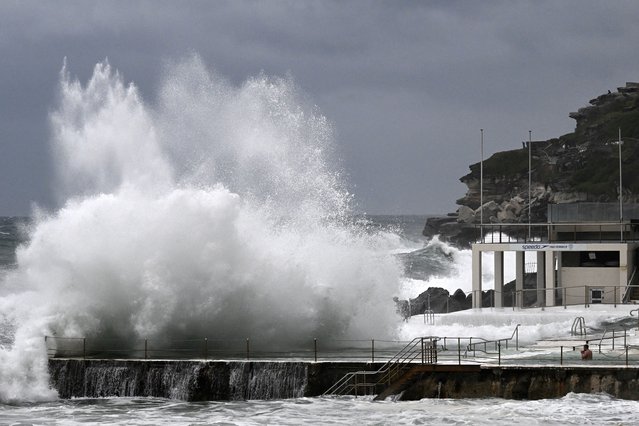 Large waves crash into the Bondi Baths and Icebergs Club at Sydney's famous Bondi Beach on July 2, 2025, as large swells and high winds hit the east coast of Australia. (Photo by Saeed Khan/AFP Photo)