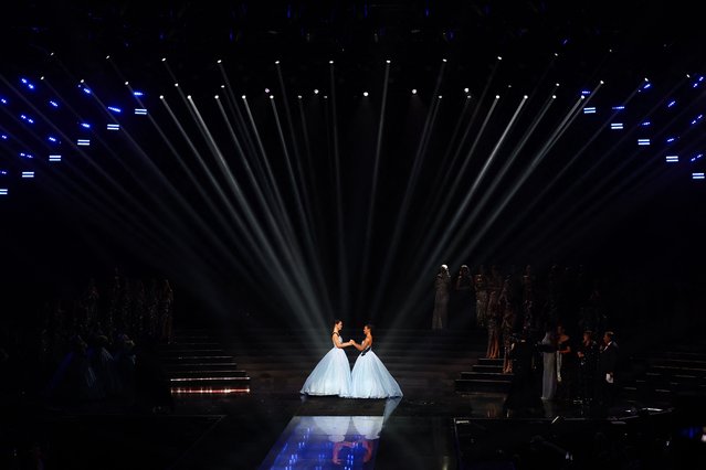 Miss Tahiti Hinaupoko Deveze (L) and Miss Nouvelle-Caledonie Juliette Collet (R) await the result on stage during the Miss France 2026 beauty pageant at the Zenith, in Amiens, northern France, on December 6, 2025. (Photo by Sameer Al-Doumy/AFP Photo)