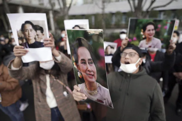 Burmese living in Japan and supporters hold pictures of Myanmar leader Aung San Suu Kyi during a protest in front of the Foreign Ministry in in Tokyo Wednesday, February 3, 2021. Myanmar's new leader said the military government installed after Monday's coup plans an investigation into alleged fraud in last year's elections and will also prioritize the COVID-19 outbreak and the economy, a state newspaper reported Wednesday. (Photo by Eugene Hoshiko/AP Photo)