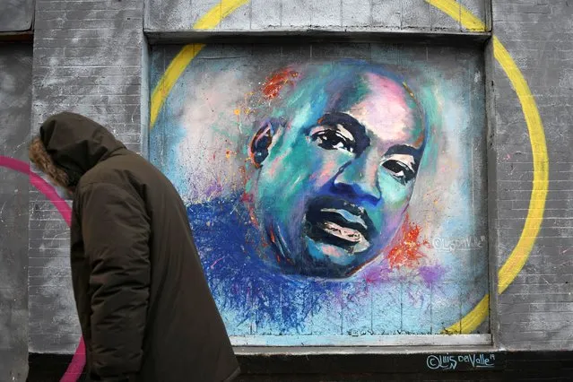 A person walks past a mural of Martin Luther King Jr. during the celebration of MLK Community Service Day in Washington D.C., days ahead of U.S. President-elect Joe Biden's inauguration, U.S. January 18, 2021. (Photo by Brandon Bell/Reuters)