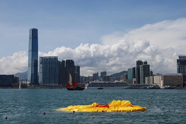 One of the inflatable yellow ducks created by Dutch artist Florentijn Hofman is seen deflated at Victoria Harbour in Hong Kong, China on June 10, 2023. (Photo by Tyrone Siu//Reuters)