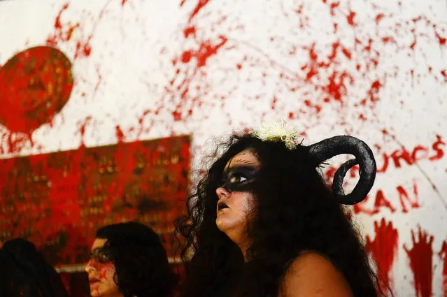 Women take part in a protest to mark the International Day for the Elimination of Violence against Women, in San Salvador, El Salvador on November 25, 2020. (Photo by Jessica Orellana/Reuters)