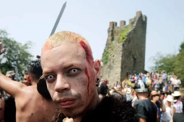 A man dressed up as a Viking attends the annual Viking festival of Catoira in north-western Spain on August 5, 2018. (Photo by Miguel Vidal/Reuters)