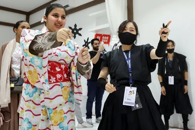 Saudi youth dressed in traditional Japanese outfit play Japanese traditional games offered by the Gamers8 Season showing Japanese culture and Japanese entertainment activities in Riyadh, Saudi Arabia on July 29, 2023. (Photo by Ahmed Yosri/Reuters)