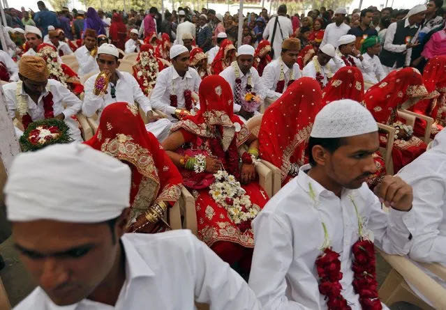 Brides and grooms take part in a mass marriage ceremony in Ahmedabad, India, January 22, 2016. (Photo by Amit Dave/Reuters)