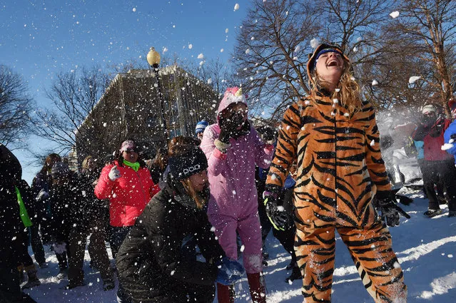 People take part in a large snowball fight in Dupont Circle on Sunday January 24, 2016 in Washington, DC. (Photo by Matt McClain/The Washington Post)