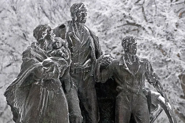 Pioneer Family monument on the mall of the state Capitol is covered in frost, Wednesday morning, January 20, 2016, in Bismarck, N.D. (Photo by Tom Stromme/The Bismarck Tribune via AP Photo)