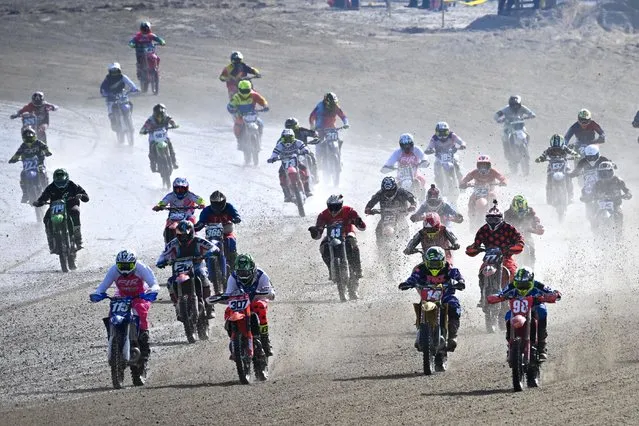 Motocross riders compete on the beach on October 15, 2023 in Weymouth, United Kingdom. The motocross event, which first came to the town in 1984, organised by Weymouth and Portland Lions Club in association with Purbeck Motocross Club, sees over 300 riders compete over a course along Weymouth beach. (Photo by Finnbarr Webster/Getty Images)