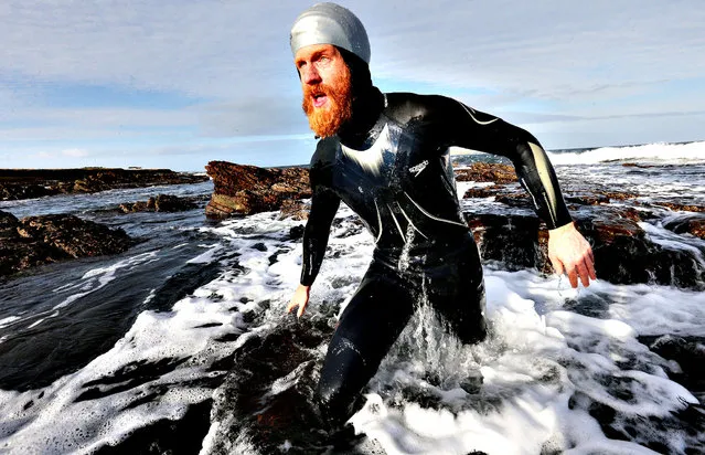 Charity swimmer Sean Conway, 32, arriving at John O'Groats, in the north of Scotland, after being the first person to swim from Lands End to John O'Groats, on November 11, 2013. (Photo by Andrew Milligan/PA Wire)