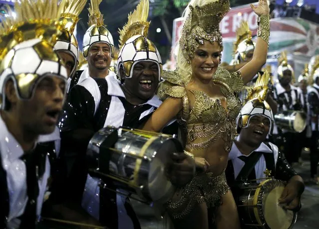 Grande Rio samba school's Drum Queen Paloma Bernardi (2nd R) and school members perform during the carnival parade at the Sambadrome in Rio de Janeiro, February 8, 2016. (Photo by Pilar Olivares/Reuters)