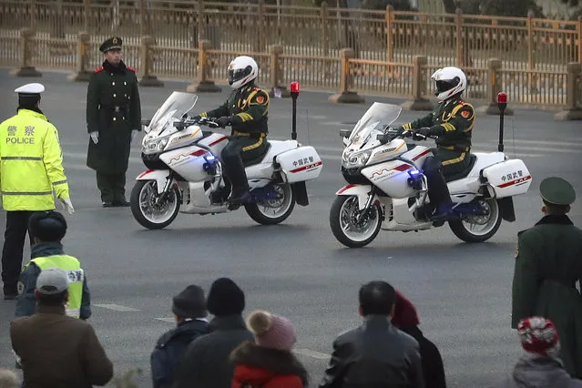 Chinese paramilitary police on motorcycles escort a motorcade believed to be carrying North Korean leader Kim Jong Un passes along a street in Beijing, Wednesday, January 9, 2019. North Korean state media reported Tuesday that Kim is making a four-day trip to China in what's likely an effort by him to coordinate with his only major ally ahead of a summit with U.S. President Donald Trump that could happen early this year. (Photo by Mark Schiefelbein/AP Photo)