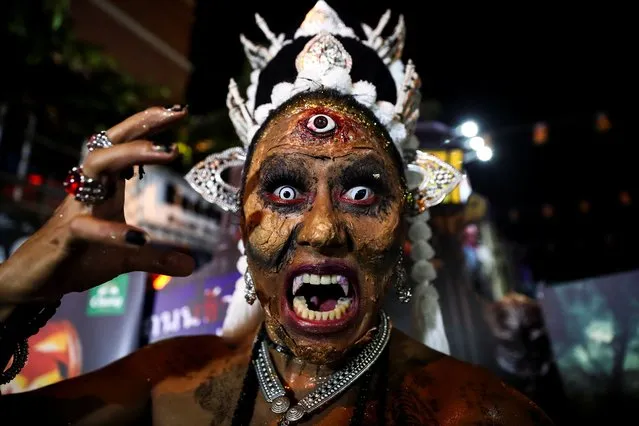 A participant wearing a costume attends Halloween night at Khaosan Road, a hub for backpackers, in Bangkok, Thailand on October 31, 2023. (Photo by Chalinee Thirasupa/Reuters)