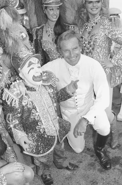 In this July 19, 1978 file photo, actor Charlton Heston is shown with Ringling Bros. and Barnum and Bailey Circus clown Prince Paul during the City of Hope's Celebrity Circus opening in Inglewood, Calif. The Ringling Bros. and Barnum & Bailey Circus will end “The Greatest Show on Earth” in May 2017, following a 146-year run of performances. Kenneth Feld, the chairman and CEO of Feld Entertainment, which owns the circus, told The Associated Press when the company removed the elephants from the shows in May of 2016, ticket sales declined more dramatically than expected. (Photo by AP Photo/McLendon)