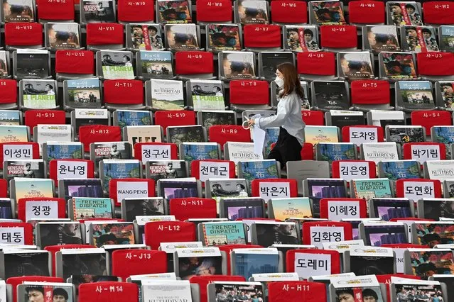 A staff member sets up seats ahead of the opening ceremony for the 26th Busan International Film Festival (BIFF) at the Busan Cinema Center in Busan on October 6, 2021. (Photo by Jung Yeon-je/AFP Photo)