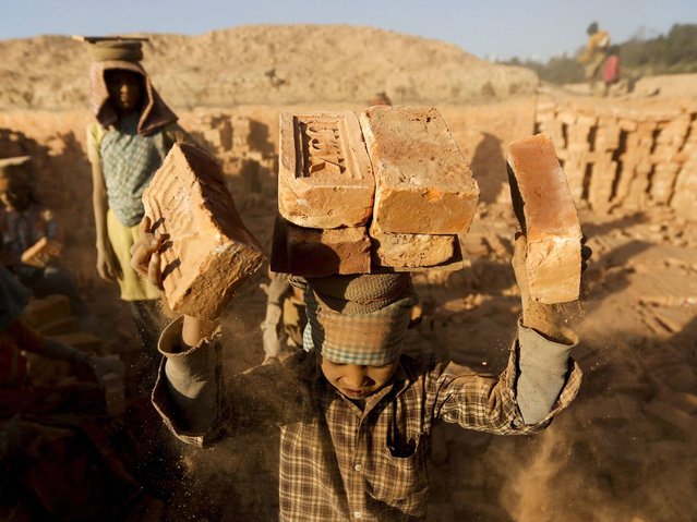 The Child Labor (Prohibition and Regulation) Act of 2000 establishes the minimum age for work at 14 and the minimum age for hazardous work at 16, however the Act does not cover nontraditional establishments in which many child laborers are found, including home-based enterprises and unregistered establishments in the informal and agricultural sectors. (Photo by Narendra Shrestha/EPA)