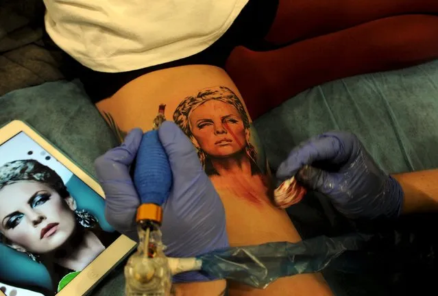 A Charlize Theron tattoo is pictured during the Asturias Tatto Expo in Gijon, north of Spain, March 18, 2016. (Photo by Eloy Alonso/Reuters)