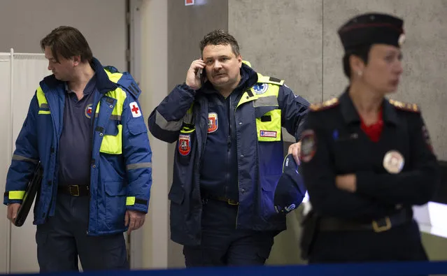 An emergency service officer speaks on a phone in the Sheremetyevo airport in Moscow, Russia, Sunday, May 5, 2019. At least 40 people died Sunday in a fiery airliner accident at Moscow's Sheremetyevo Airport, a spokeswoman for the Russian Investigative Committee said. (Photo by Alexander Zemlianichenko/AP Photo)