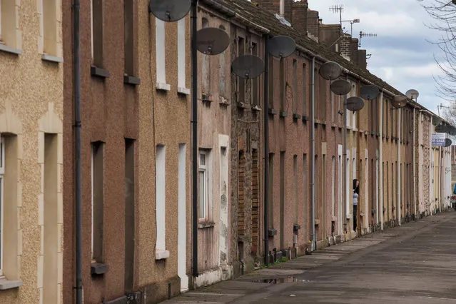 A woman looks out of the door of her terraced home near the Tata Steel steel plant at Port Talbot on March 30, 2016 in Port Talbot, Wales. Indian owners Tata Steel  put its British business up for sale yesterday, placing thousands of jobs at risk and hitting the already floundering UK steel industry. (Photo by Christopher Furlong/Getty Images)