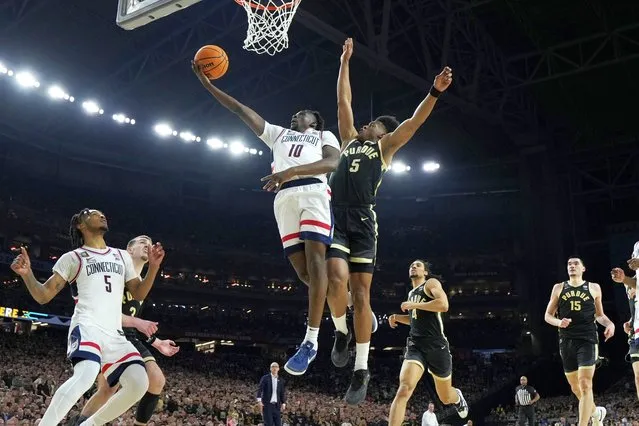 UConn guard Hassan Diarra (10) shoots past Purdue guard Myles Colvin during the second half of the NCAA college Final Four championship basketball game, Monday, April 8, 2024, in Glendale, Ariz. (Photo by Brynn Anderson/AP Photo)