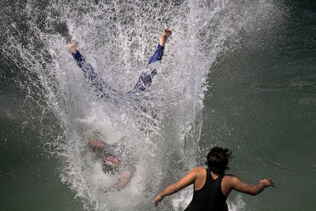 Youth enjoy at a water park on a hot summer day in Lahore on May 26, 2024. (Photo by Arif Ali/AFP Photo)