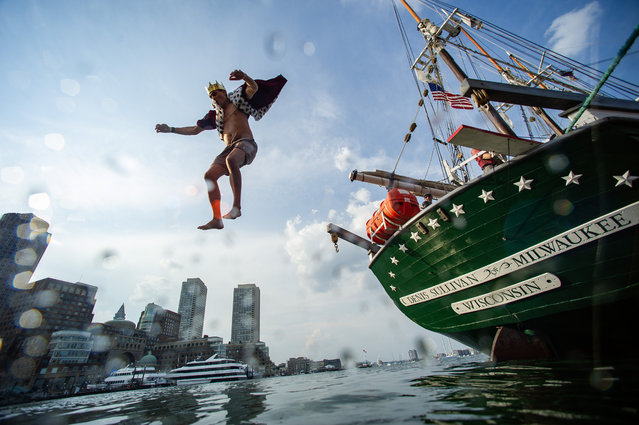 Costumed revelers walk the plank and jump off the tall ship Denis Sullivan and into Boston Harbor during a heatwave in Boston, Massachusetts, United States on June 20, 2024. The event supports the World Ocean School. (Photo by Joseph Prezioso/Anadolu via Getty Images)