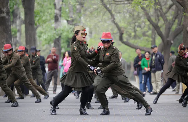 Local residents dance at Tiantan Park, in central Beijing, China, April 16, 2017. (Photo by Jason Lee/Reuters)