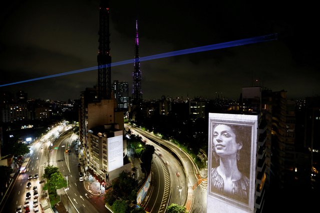 An image of late activist and councilwoman Marielle Franco is projected onto a building during a tribute to mark the fifth anniversary of her murder, in Sao Paulo, Brazil on March 14, 2023. (Photo by Amanda Perobelli/Reuters)