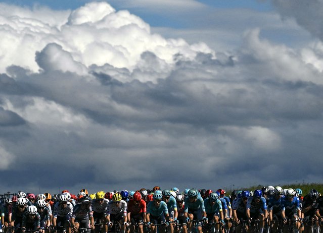 The pack of riders (peloton) cycles during the 6th stage of the 111th edition of the Tour de France cycling race, 163,5 km between Macon and Dijon, on July 4, 2024. (Photo by Marco Bertorello/AFP Photo)