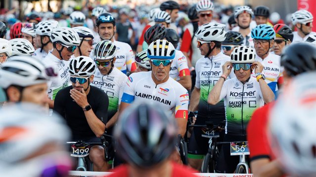 Cyclists wait for the start of the traditional “La Indurain” cycling race in Villava, Navarra, Spain, 20 July 2024. (Photo by Villar Lopez/EPA/EFE)