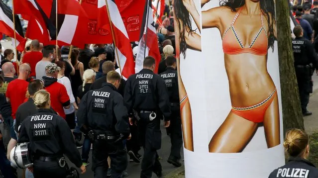 Police escort far-right supporters as they take part in a demonstration march in Dortmund, Germany, June 4, 2016. (Photo by Wolfgang Rattay/Reuters)